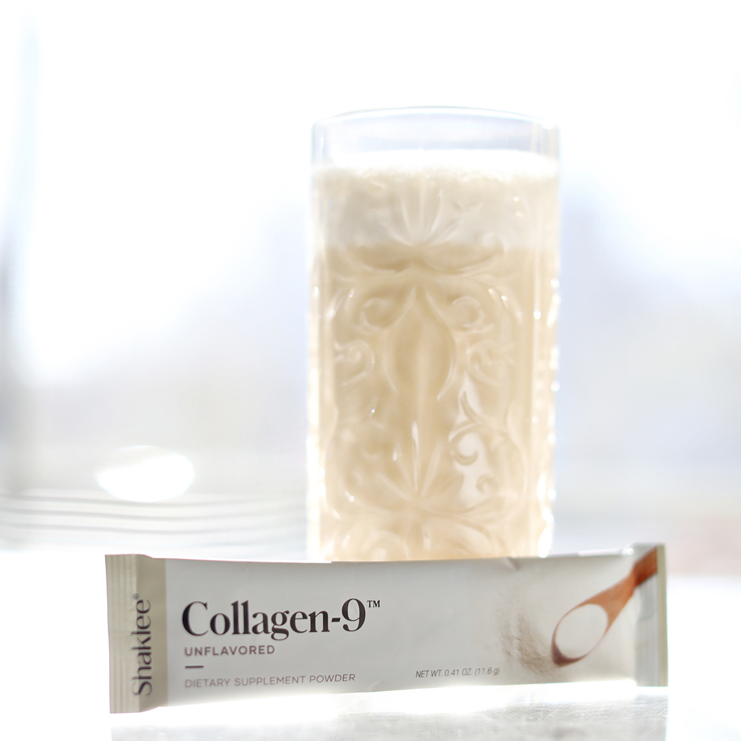 A Life-Shake vanilla shake and a Collagen-9 packet sit on a brightly sunlit table